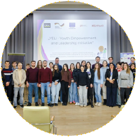 Group photo of young participants and organisers at a Youth Empowerment and Leadership Initiative (YELI) event, standing on stage in front of a presentation screen. Group photo of young participants and organisers at a Youth Empowerment and Leadership Initiative (YELI) event, standing on stage in front of a presentation screen.