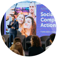 Speaker presenting at an EU4Youth international conference in Chișinău on youth-led social enterprises, with participants attending the event. Speaker presenting at an EU4Youth international conference in Chișinău on youth-led social enterprises, with participants attending the event.